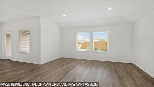 empty room with dark hardwood / wood-style floors and lofted ceiling