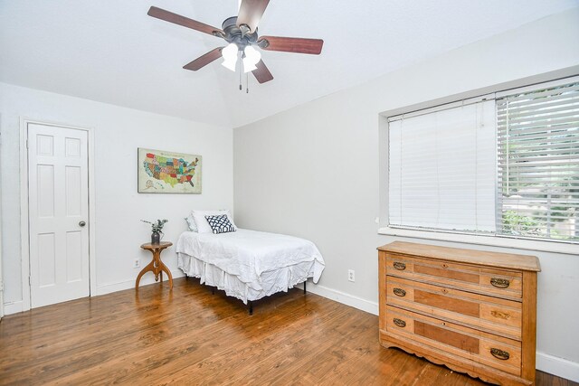 bedroom featuring ceiling fan, lofted ceiling, and hardwood / wood-style floors