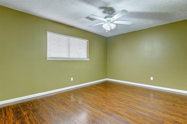 unfurnished room with hardwood / wood-style flooring, a textured ceiling, and ceiling fan