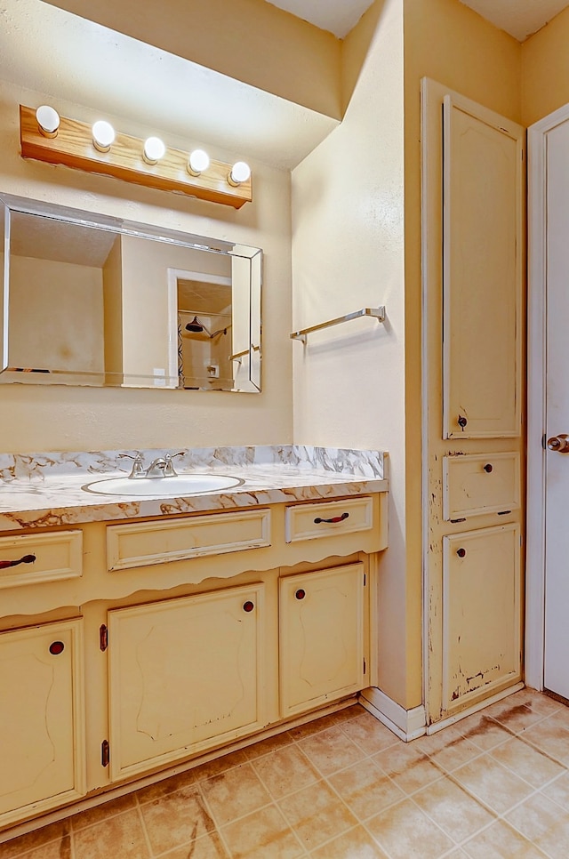 bathroom with tile patterned floors and vanity