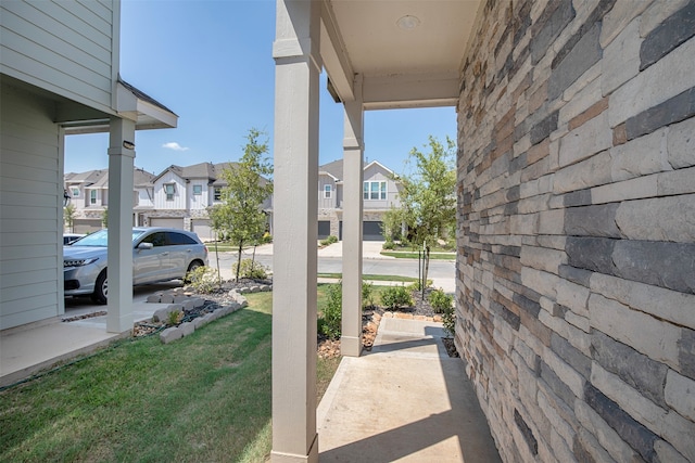 view of patio / terrace featuring a garage and covered porch