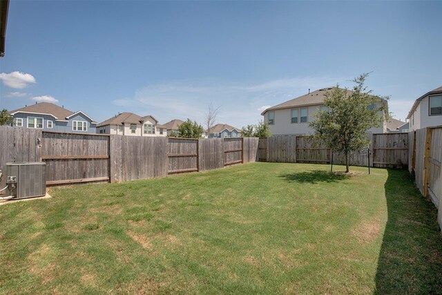 view of yard featuring central AC unit