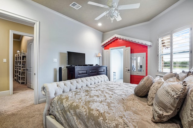 bedroom with visible vents, baseboards, carpet flooring, and crown molding