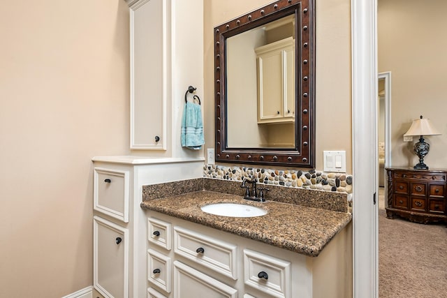 bathroom featuring vanity and baseboards