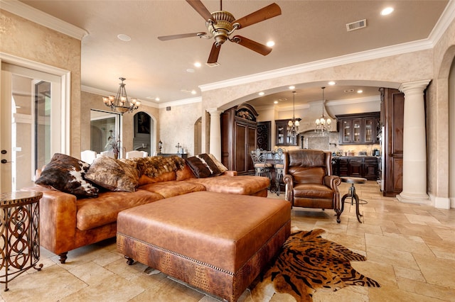 living room with visible vents, decorative columns, arched walkways, stone tile flooring, and ceiling fan with notable chandelier