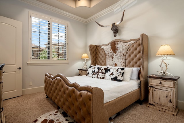 bedroom with carpet floors, baseboards, and ornamental molding