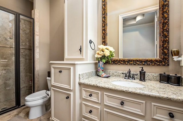 full bath with vanity, a shower stall, toilet, and crown molding