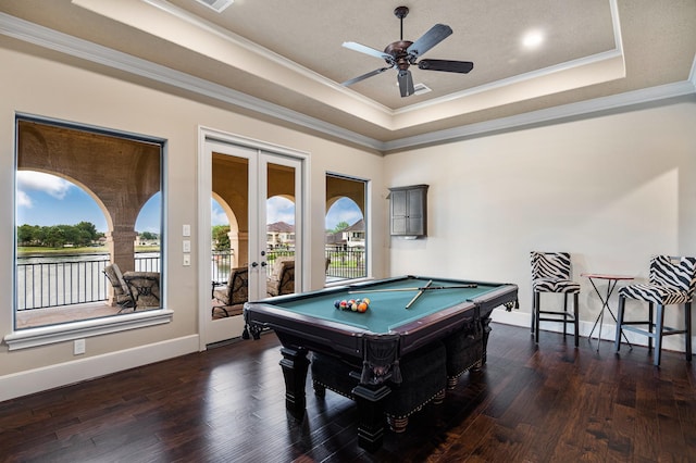 recreation room featuring a wealth of natural light, billiards, a raised ceiling, and wood finished floors