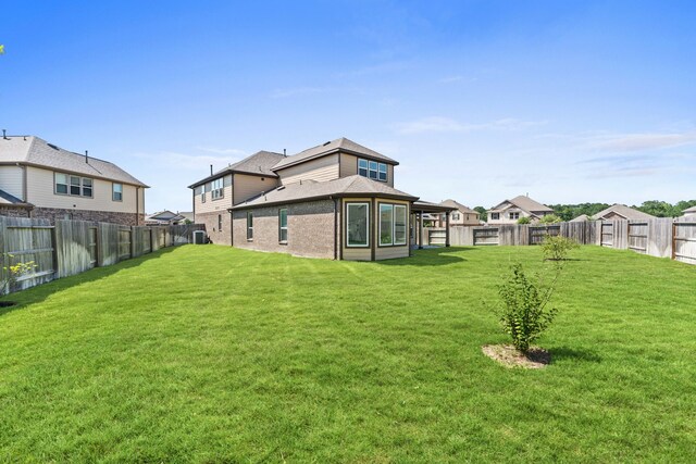 view of yard featuring a residential view and a fenced backyard