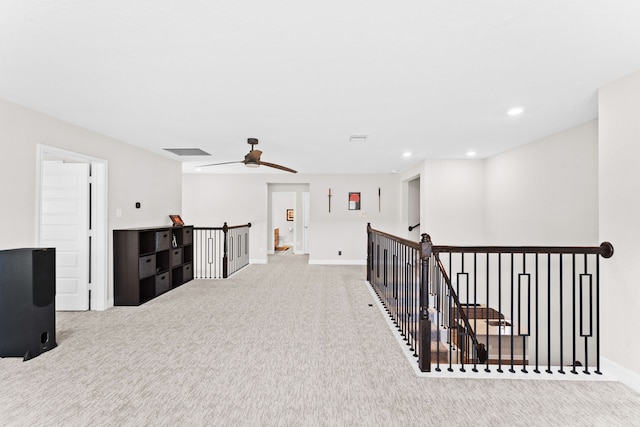 hallway with visible vents, an upstairs landing, recessed lighting, carpet flooring, and baseboards