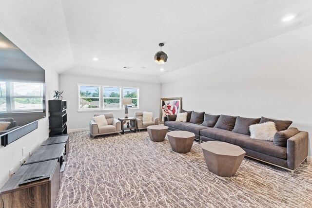 living room featuring vaulted ceiling