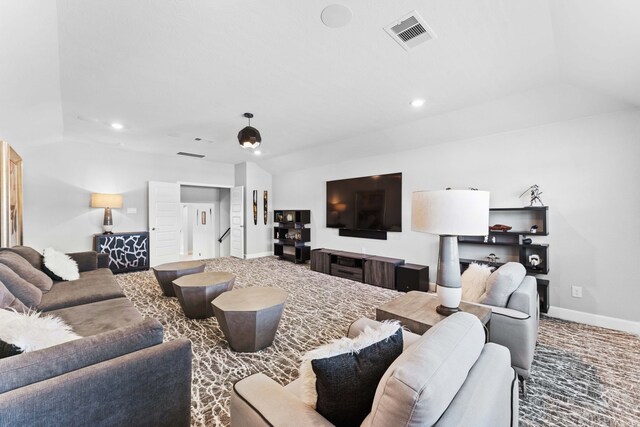 living room featuring vaulted ceiling and carpet