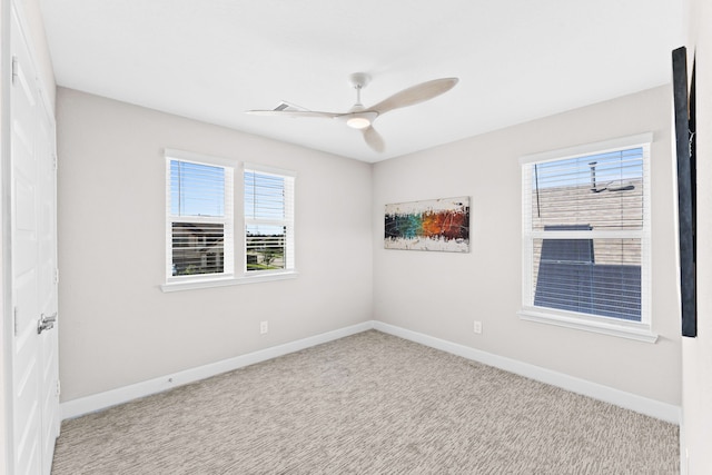 empty room with carpet floors and ceiling fan