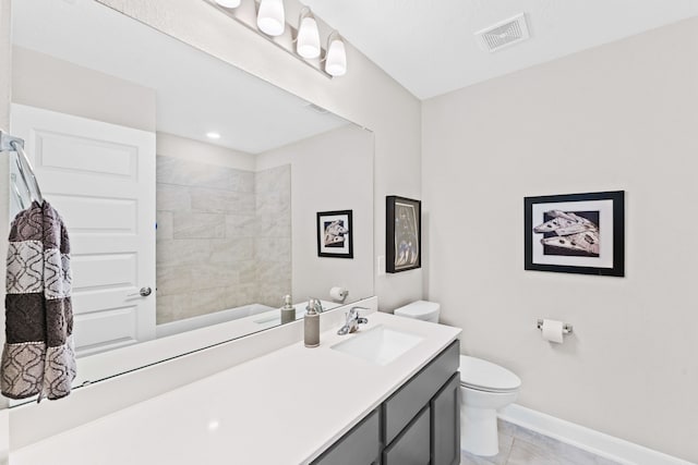 bathroom featuring visible vents, toilet, vanity, and baseboards