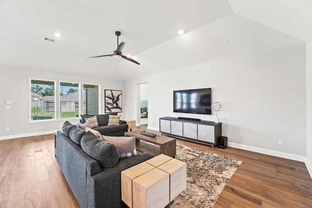 living room featuring ceiling fan, wood-type flooring, and lofted ceiling