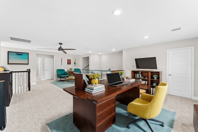 office featuring ceiling fan and light colored carpet