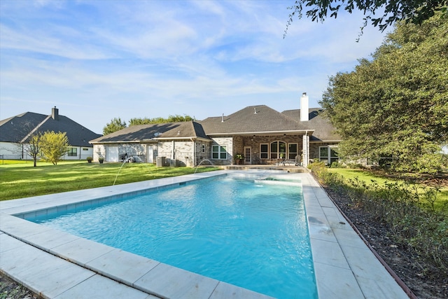 view of swimming pool featuring a patio area and a yard