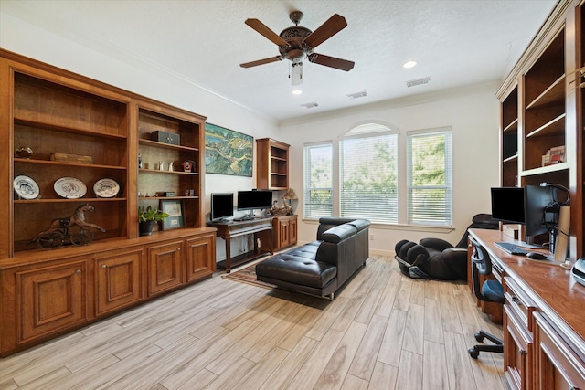 home office featuring light hardwood / wood-style flooring, ceiling fan, and ornamental molding