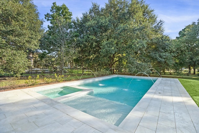 view of swimming pool with an in ground hot tub, pool water feature, and a patio area