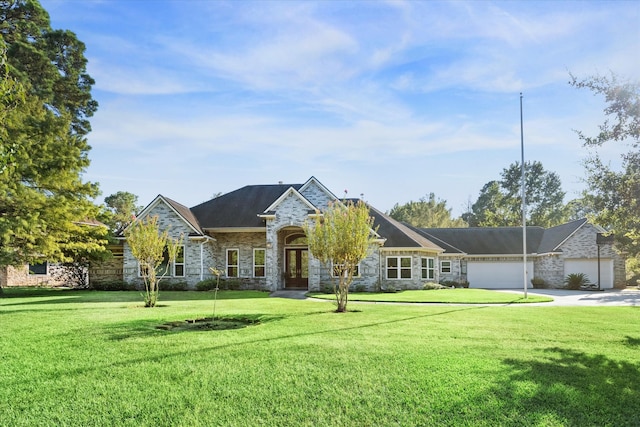 view of front of property featuring a garage and a front yard