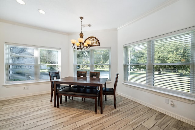 dining area featuring a notable chandelier, light wood-type flooring, and ornamental molding