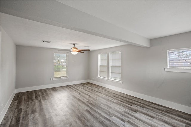 empty room with ceiling fan and hardwood / wood-style flooring