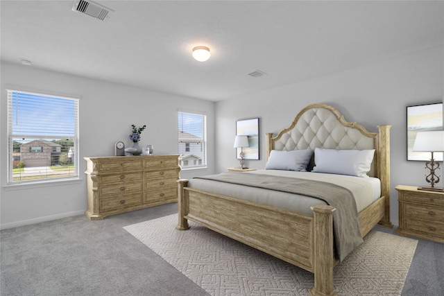 bedroom featuring light carpet