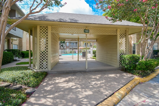 view of front of house featuring a community pool