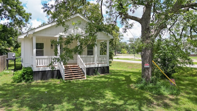 exterior space with a front lawn and covered porch