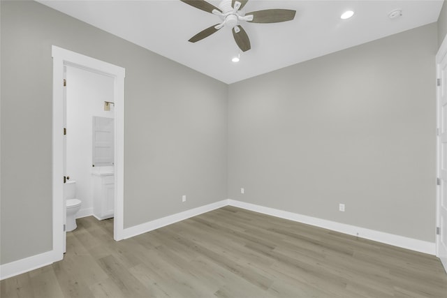 unfurnished bedroom with light wood finished floors, recessed lighting, ensuite bathroom, ceiling fan, and baseboards