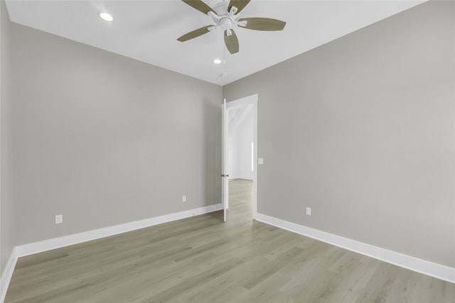 unfurnished room with light wood finished floors, recessed lighting, a ceiling fan, and baseboards