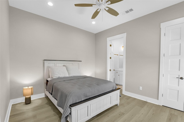 975 Alberdie Dr, Crystal Beach, TX 77650 - bedroom featuring baseboards, light wood finished floors, recessed lighting, ensuite bathroom, and a ceiling fan