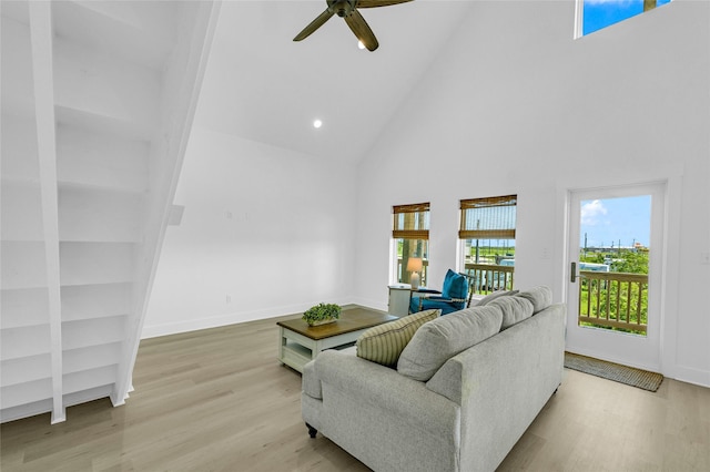 975 Alberdie Dr, Crystal Beach, TX 77650 - living area with high vaulted ceiling, wood finished floors, a ceiling fan, baseboards, and recessed lighting