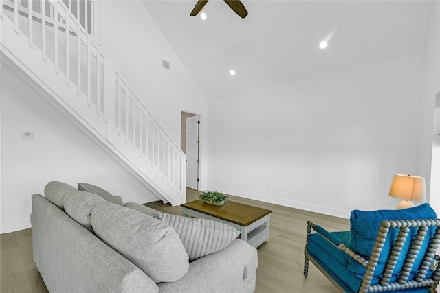 975 Alberdie Dr, Crystal Beach, TX 77650 - living room featuring stairway, wood finished floors, ceiling fan, baseboards, and recessed lighting