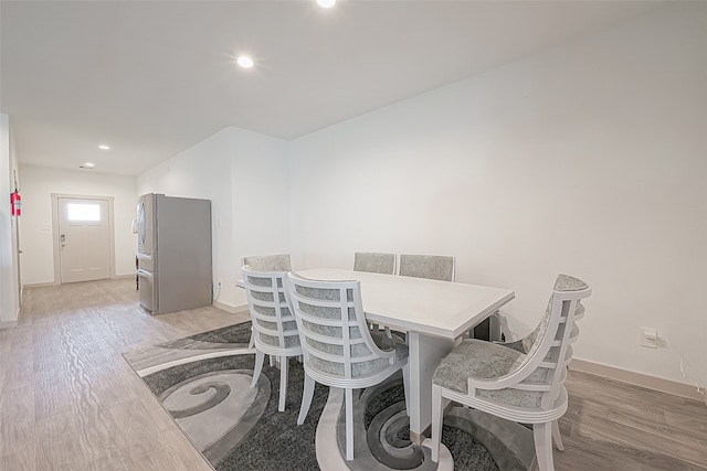 dining space with light hardwood / wood-style flooring