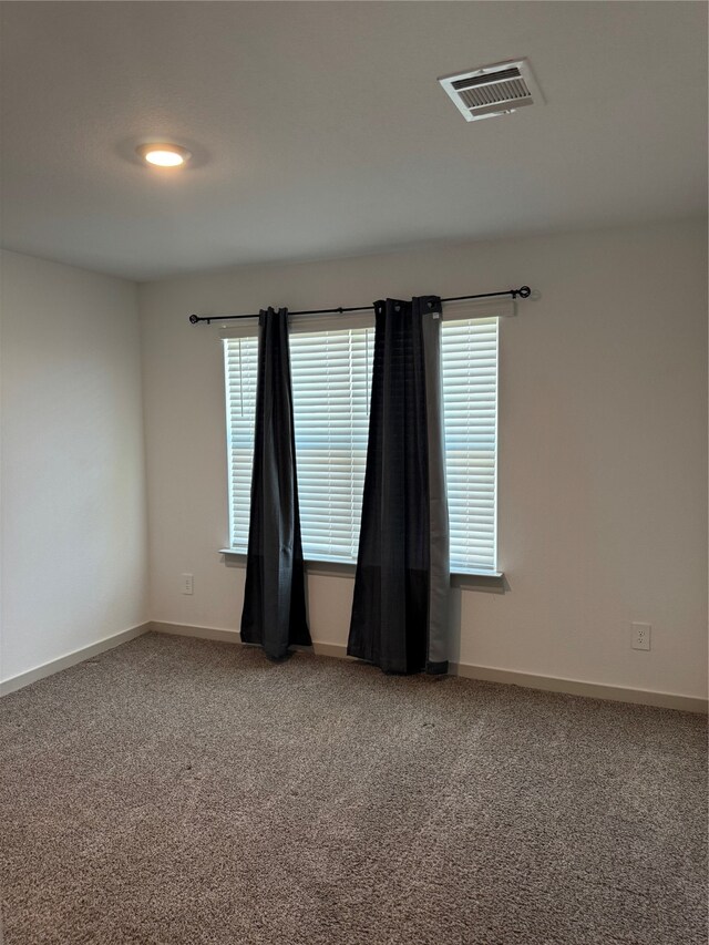 empty room with carpet flooring