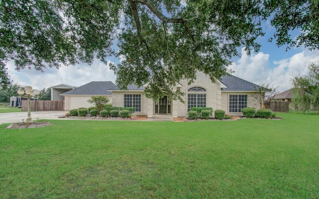 ranch-style house with a front lawn and a garage