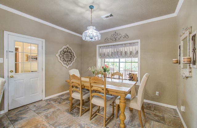 dining room with an inviting chandelier and crown molding