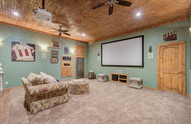 home theater room with ceiling fan, carpet flooring, an AC wall unit, and wooden ceiling