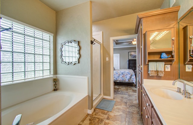 bathroom with shower with separate bathtub, vanity, and plenty of natural light