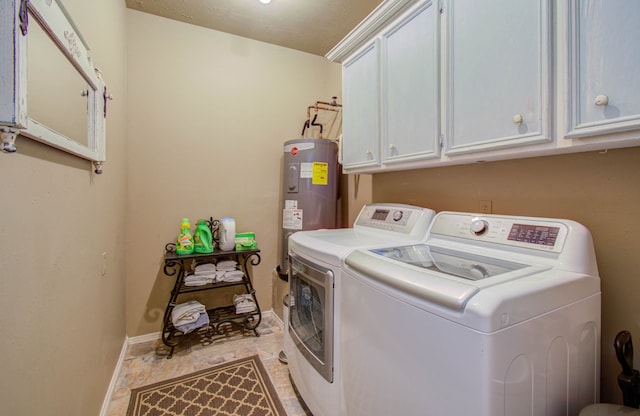 washroom featuring washing machine and dryer, light tile patterned flooring, electric water heater, a textured ceiling, and cabinets