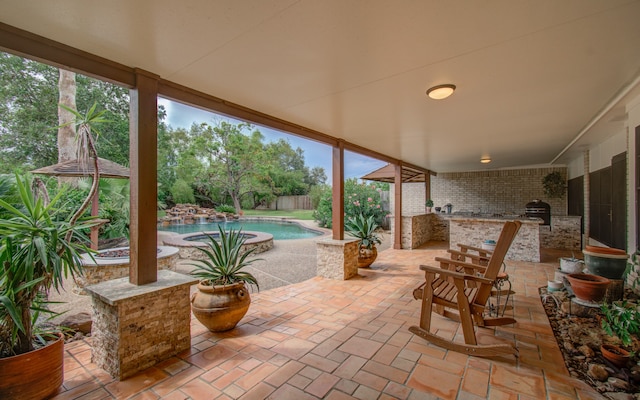 view of patio / terrace featuring a fenced in pool and a grill