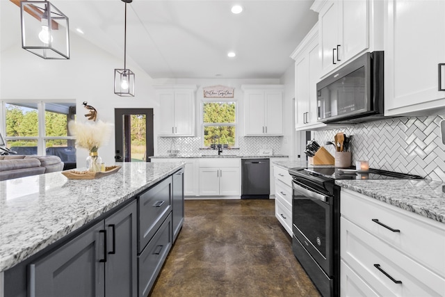 kitchen with white cabinets, stainless steel appliances, and plenty of natural light