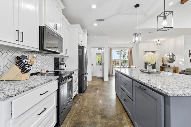 kitchen with tasteful backsplash, black appliances, white cabinets, a kitchen island, and hanging light fixtures