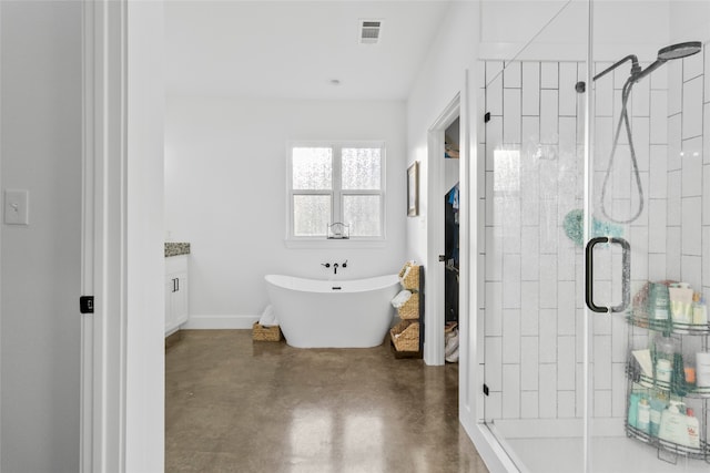 bathroom with concrete floors and independent shower and bath