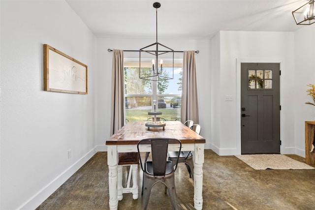 dining room featuring dark colored carpet and an inviting chandelier