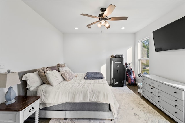 bedroom with ceiling fan and dark hardwood / wood-style floors