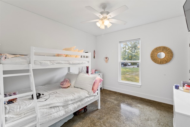 bedroom featuring ceiling fan and concrete flooring