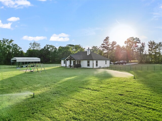 view of yard with a carport