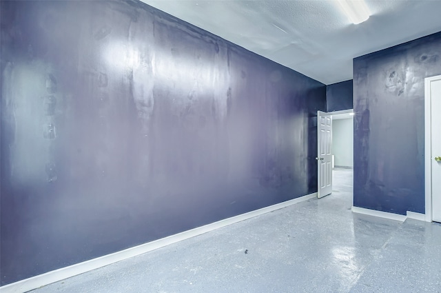 empty room featuring a textured ceiling